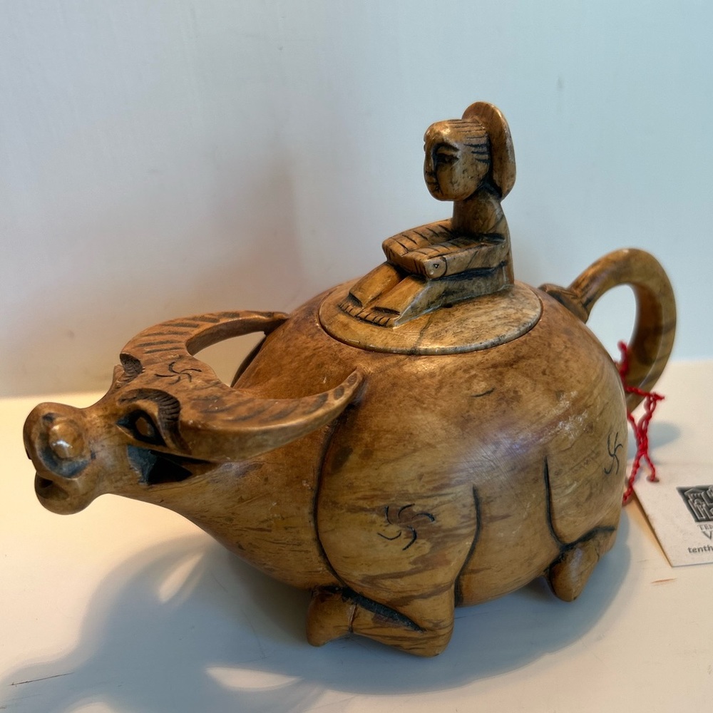 Vintage tea pot carved buffalo